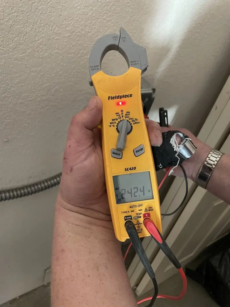 Voltage testing with clamp meter during Electrical Installation Services in Palmyra